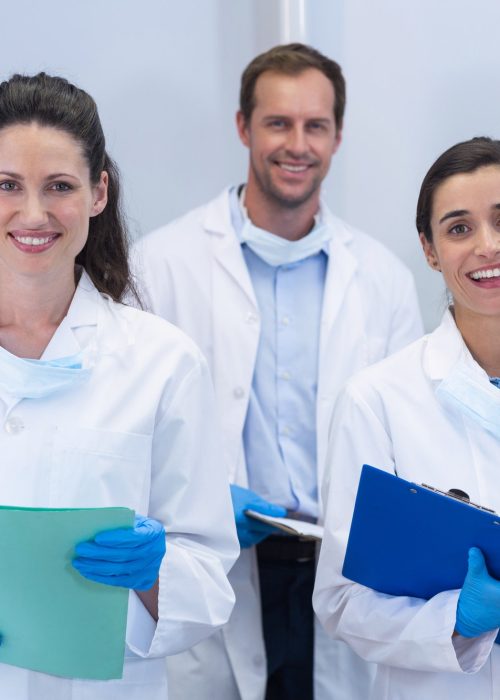 smiling-dentists-standing-in-dental-clinic.jpg